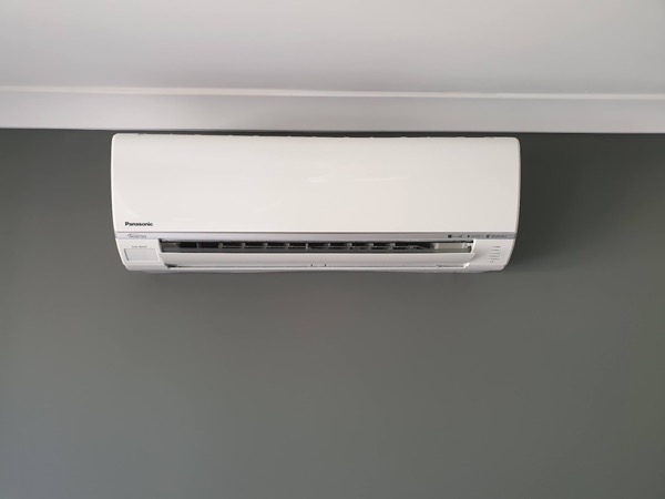 A wall-mounted split system air conditioner