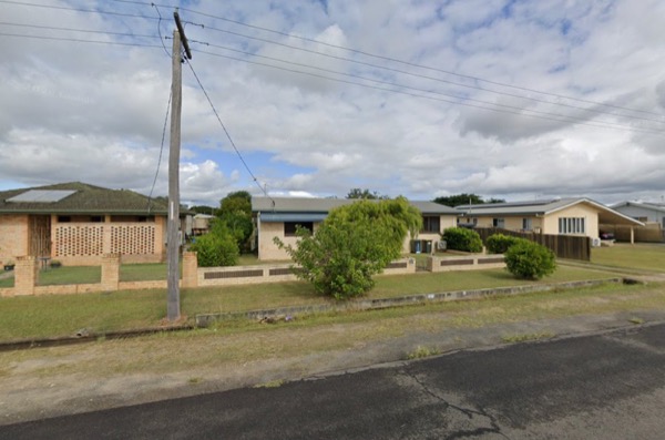 A power pole and overhead lines on a Queensland street